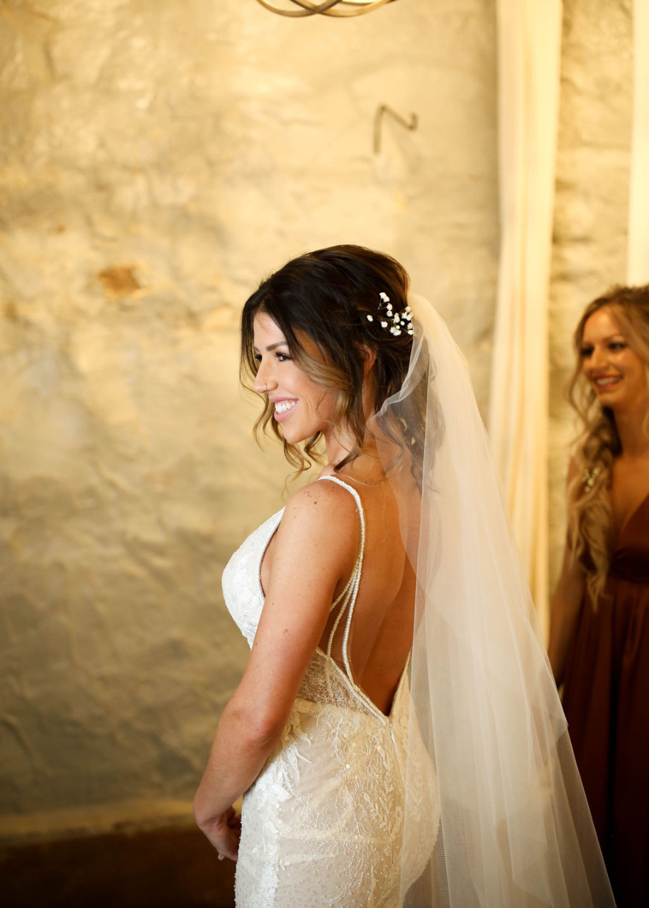 Wedding Table with wooden crossback chairs, light blue tablecloth and hydrangea florals.